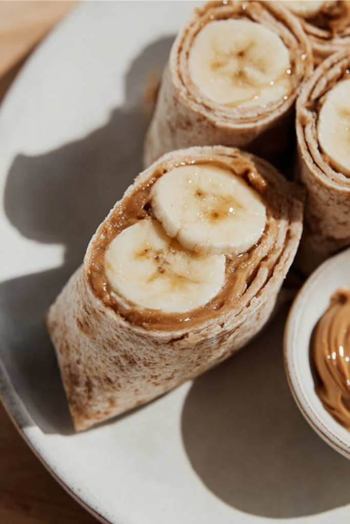 Peanut butter banana wrap with honey and granola — a quick healthy breakfast idea ready in 5 minutes